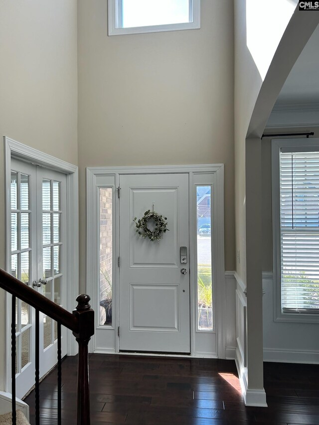 60 Fork Branch Ct, Irmo, SC 29063 - entrance foyer with dark wood-type flooring, stairway, a wealth of natural light, and a wainscoted wall