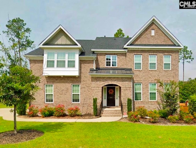 craftsman-style home with a front lawn