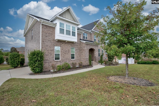 craftsman-style home with a front yard