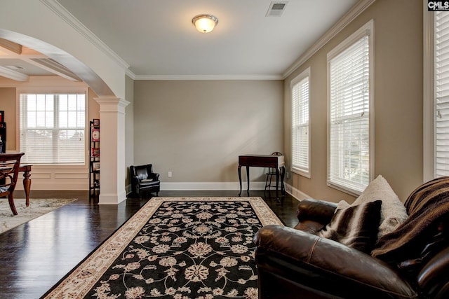 interior space with ornate columns, dark hardwood / wood-style flooring, crown molding, and coffered ceiling