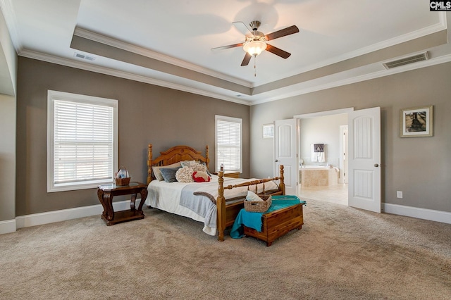 bedroom with carpet flooring, ensuite bath, and ceiling fan