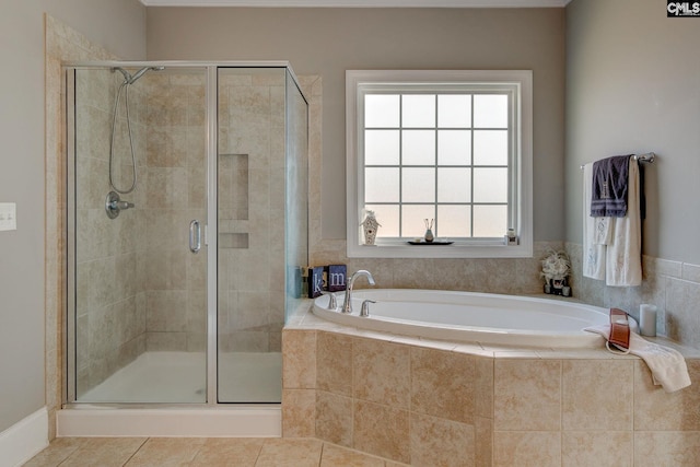 bathroom with shower with separate bathtub and tile patterned floors