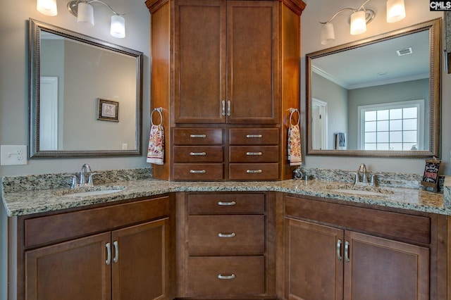 bathroom featuring vanity and crown molding