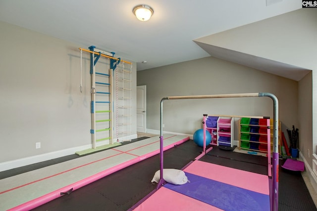 workout area featuring lofted ceiling