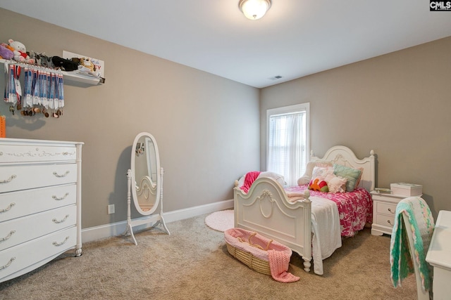 bedroom featuring light colored carpet