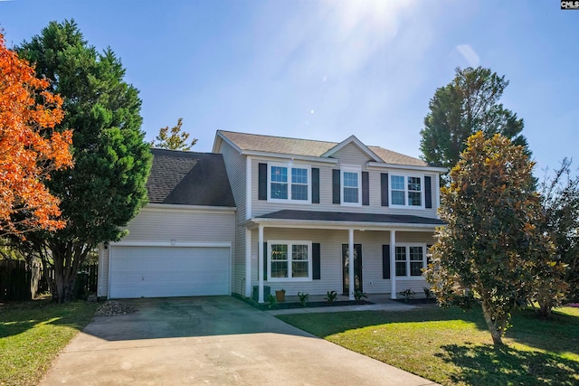 view of front of property featuring a porch, a front yard, and a garage