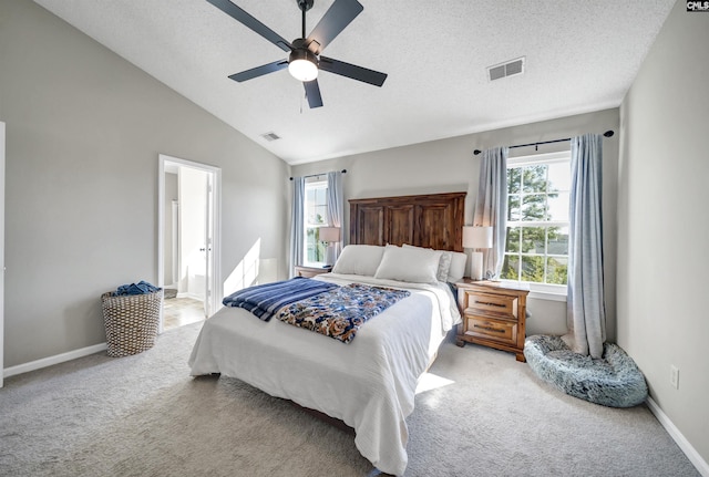 bedroom with visible vents, multiple windows, and light colored carpet