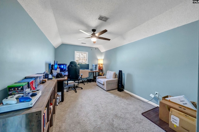 office space featuring lofted ceiling, carpet floors, a textured ceiling, and ceiling fan