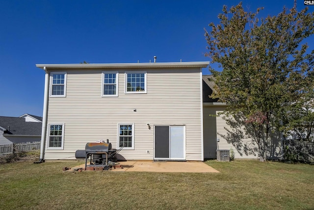 back of property featuring a patio, fence, and a yard