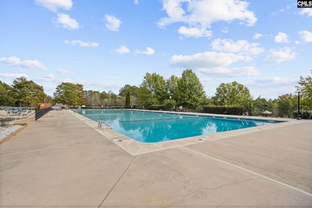 view of swimming pool with a patio area