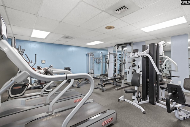 gym featuring a drop ceiling