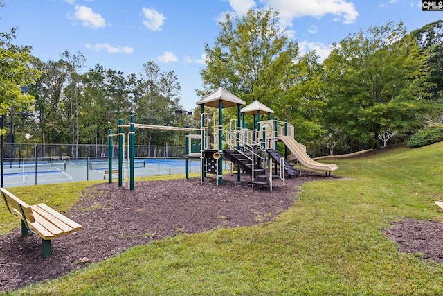 view of jungle gym with a lawn