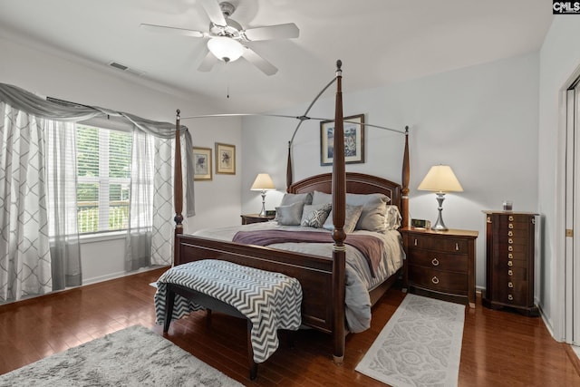 bedroom featuring ceiling fan and dark hardwood / wood-style flooring