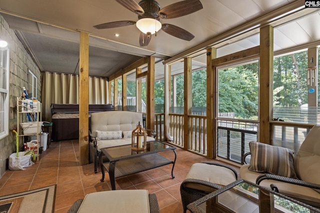 sunroom / solarium featuring ceiling fan