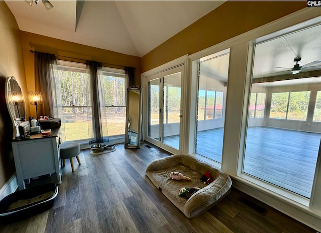 sunroom / solarium featuring ceiling fan and lofted ceiling