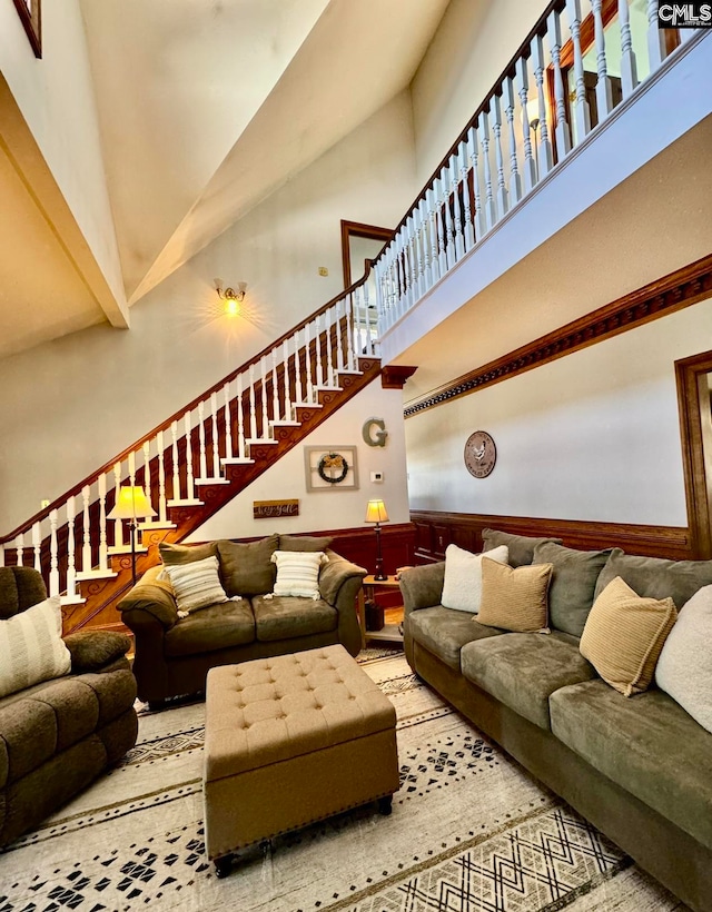 living room featuring high vaulted ceiling