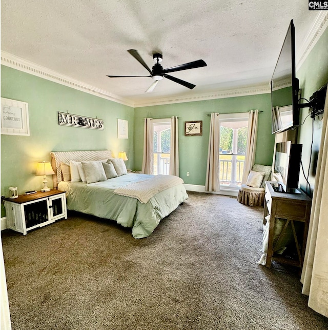 bedroom featuring ceiling fan, a textured ceiling, ornamental molding, and dark colored carpet