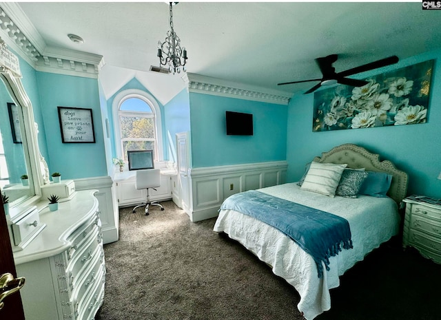 carpeted bedroom featuring ceiling fan and crown molding