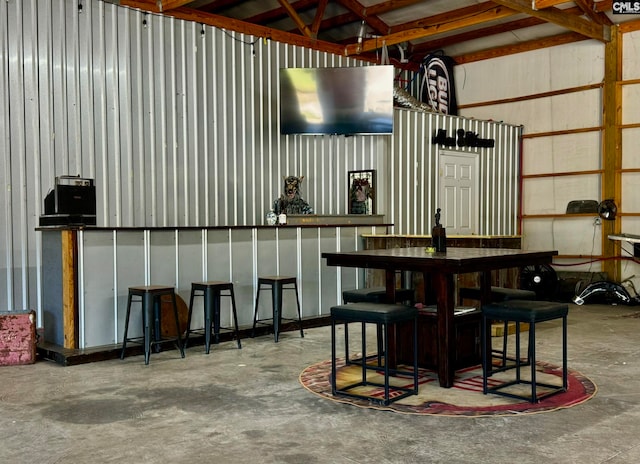 dining room with concrete flooring