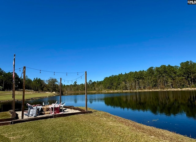 dock area featuring a yard and a water view