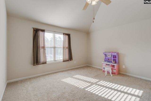 recreation room featuring ceiling fan, lofted ceiling, and light colored carpet