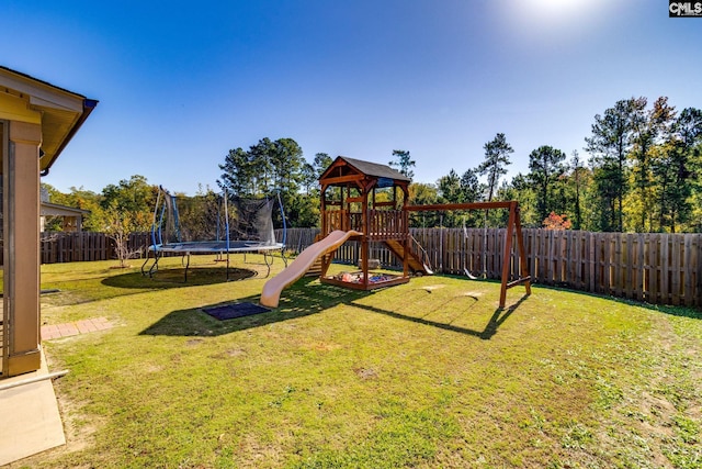 view of playground featuring a yard and a trampoline