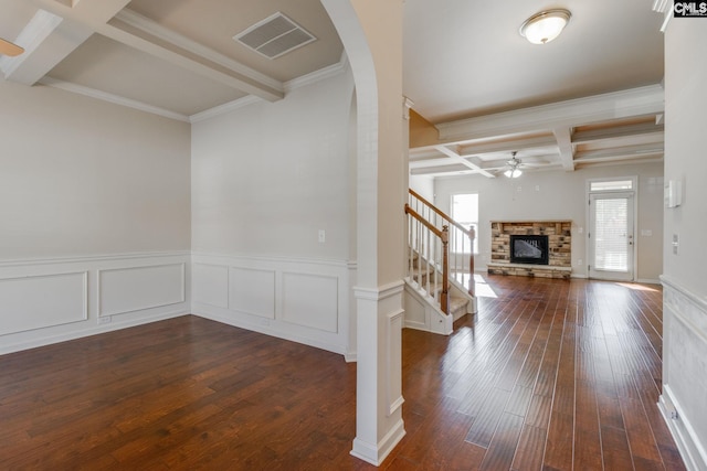 entrance foyer with beam ceiling, ceiling fan, dark hardwood / wood-style flooring, crown molding, and coffered ceiling