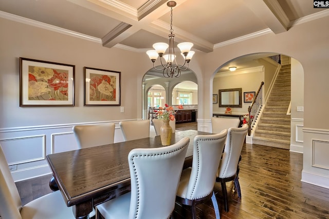 dining room featuring ornamental molding, a chandelier, dark hardwood / wood-style floors, and coffered ceiling