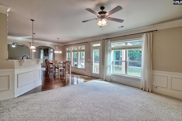 dining room featuring ceiling fan, crown molding, and dark hardwood / wood-style floors