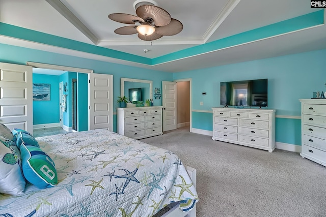 carpeted bedroom featuring ornamental molding, a raised ceiling, and ceiling fan