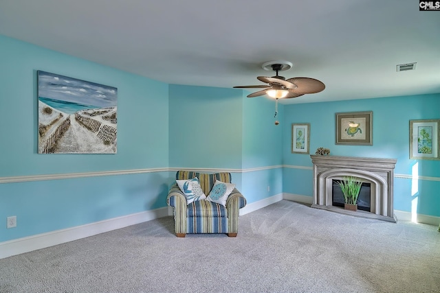 sitting room with carpet floors and ceiling fan