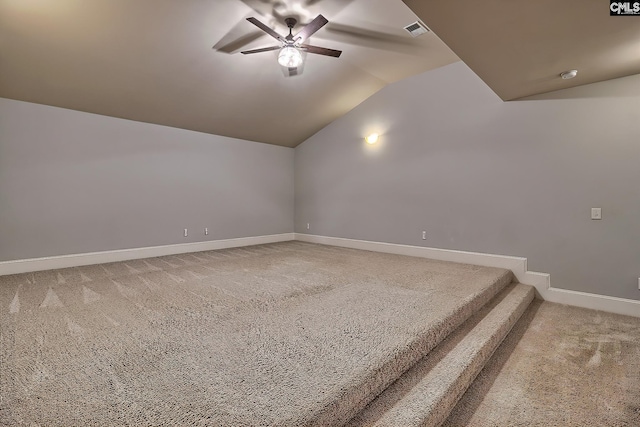 bonus room featuring lofted ceiling, carpet floors, and ceiling fan