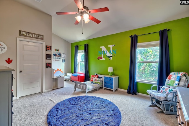 playroom featuring ceiling fan, carpet flooring, and vaulted ceiling