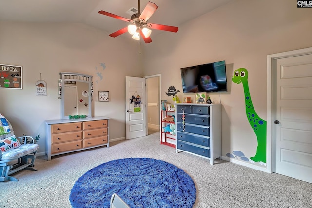 carpeted bedroom with high vaulted ceiling and ceiling fan