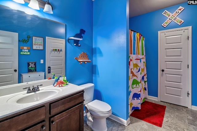 bathroom with toilet and vanity