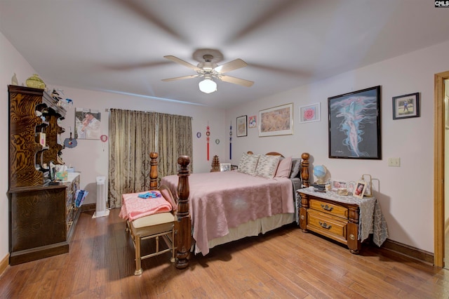 bedroom with light wood-type flooring and ceiling fan