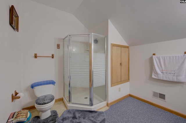 bathroom with toilet, walk in shower, and vaulted ceiling