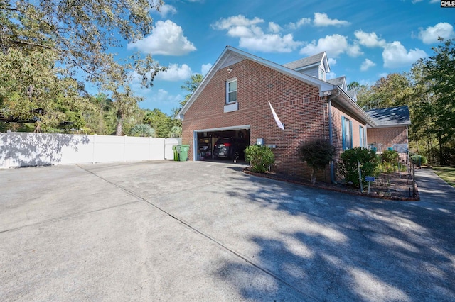 view of side of home with a garage