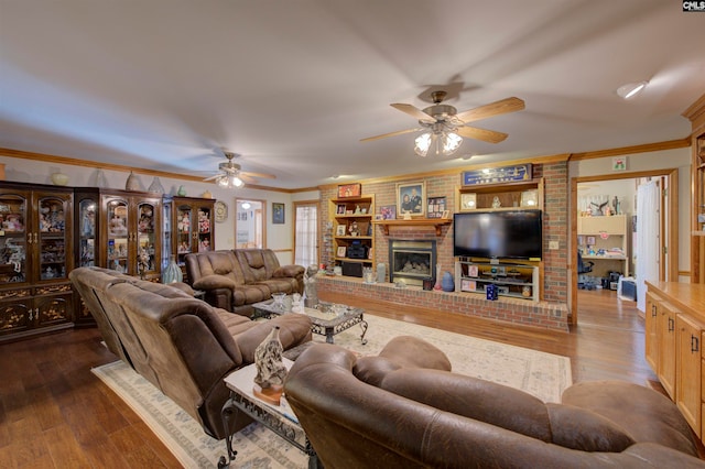 living room with crown molding, hardwood / wood-style floors, and ceiling fan