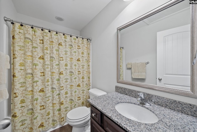 bathroom with vanity, toilet, and a shower with shower curtain