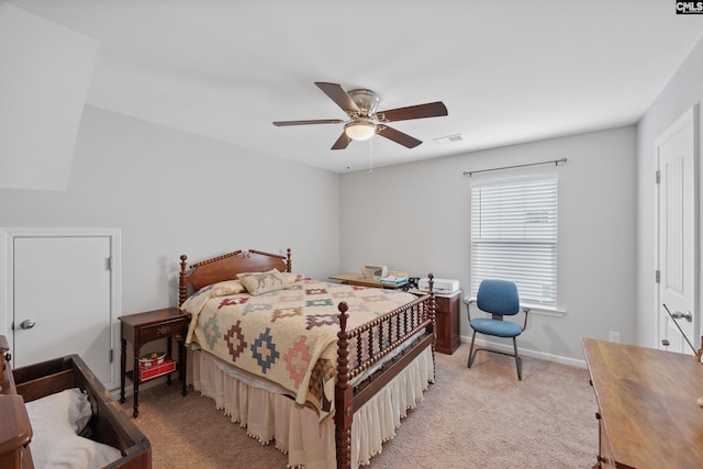 carpeted bedroom with ceiling fan