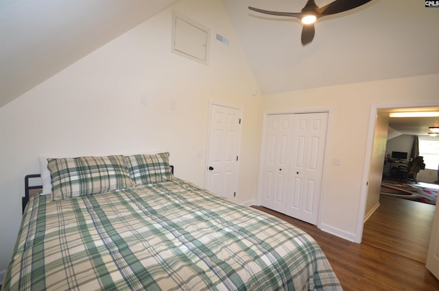 bedroom featuring lofted ceiling, dark wood-type flooring, a closet, and ceiling fan