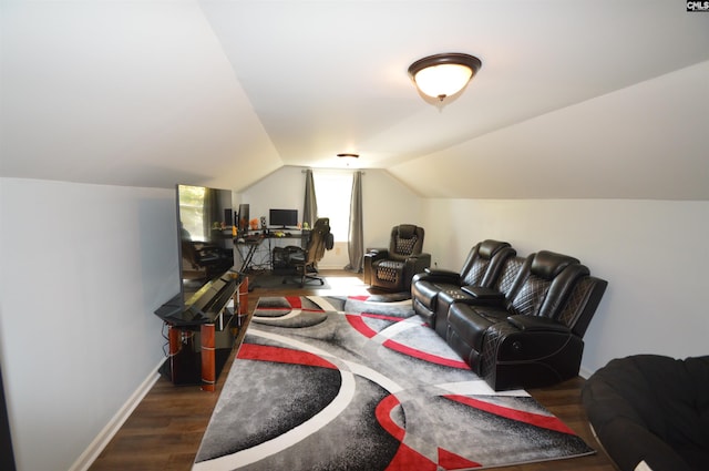 interior space featuring lofted ceiling and dark hardwood / wood-style floors