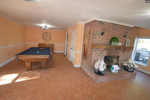 game room featuring crown molding, tile patterned floors, billiards, and a brick fireplace