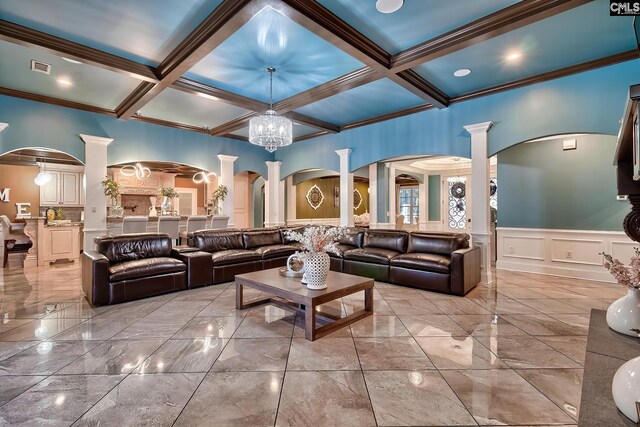 224 Robin Hood Rd, Elgin, SC 29045 - living area with arched walkways, a chandelier, built in shelves, ornamental molding, and coffered ceiling
