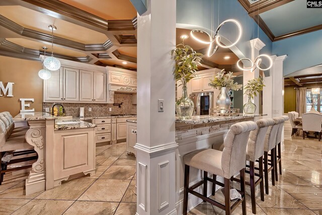 224 Robin Hood Rd, Elgin, SC 29045 - kitchen with crown molding, arched walkways, a peninsula, and stainless steel appliances