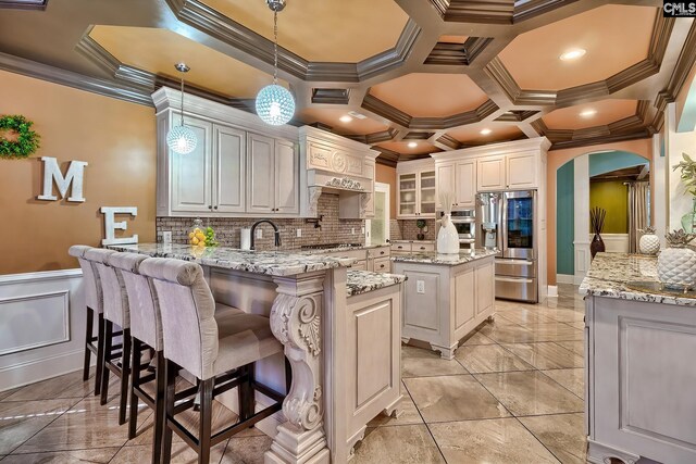 224 Robin Hood Rd, Elgin, SC 29045 - kitchen featuring crown molding, a peninsula, gas cooktop, and a center island