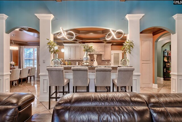 224 Robin Hood Rd, Elgin, SC 29045 - kitchen featuring visible vents, light stone countertops, a sink, a notable chandelier, and ornamental molding
