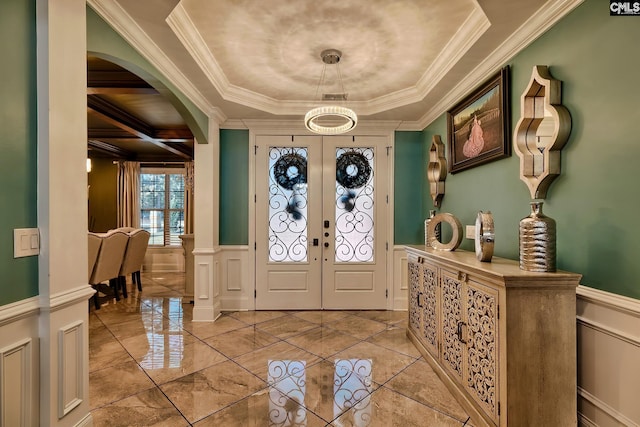 224 Robin Hood Rd, Elgin, SC 29045 - foyer entrance with crown molding, plenty of natural light, and a wainscoted wall