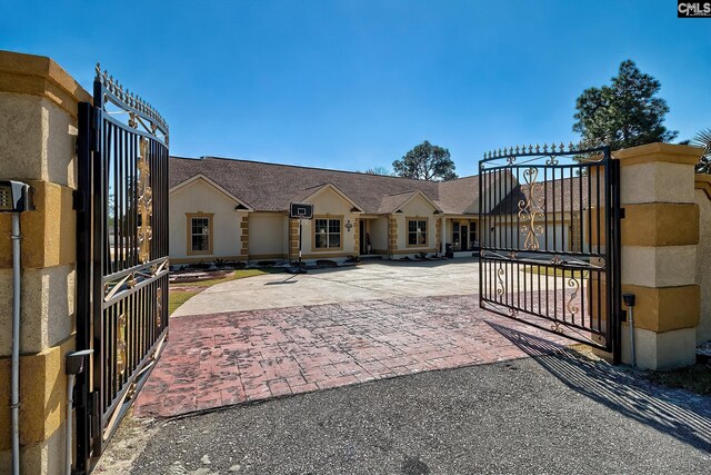 224 Robin Hood Rd, Elgin, SC 29045 - view of front of property featuring stucco siding and a fenced front yard